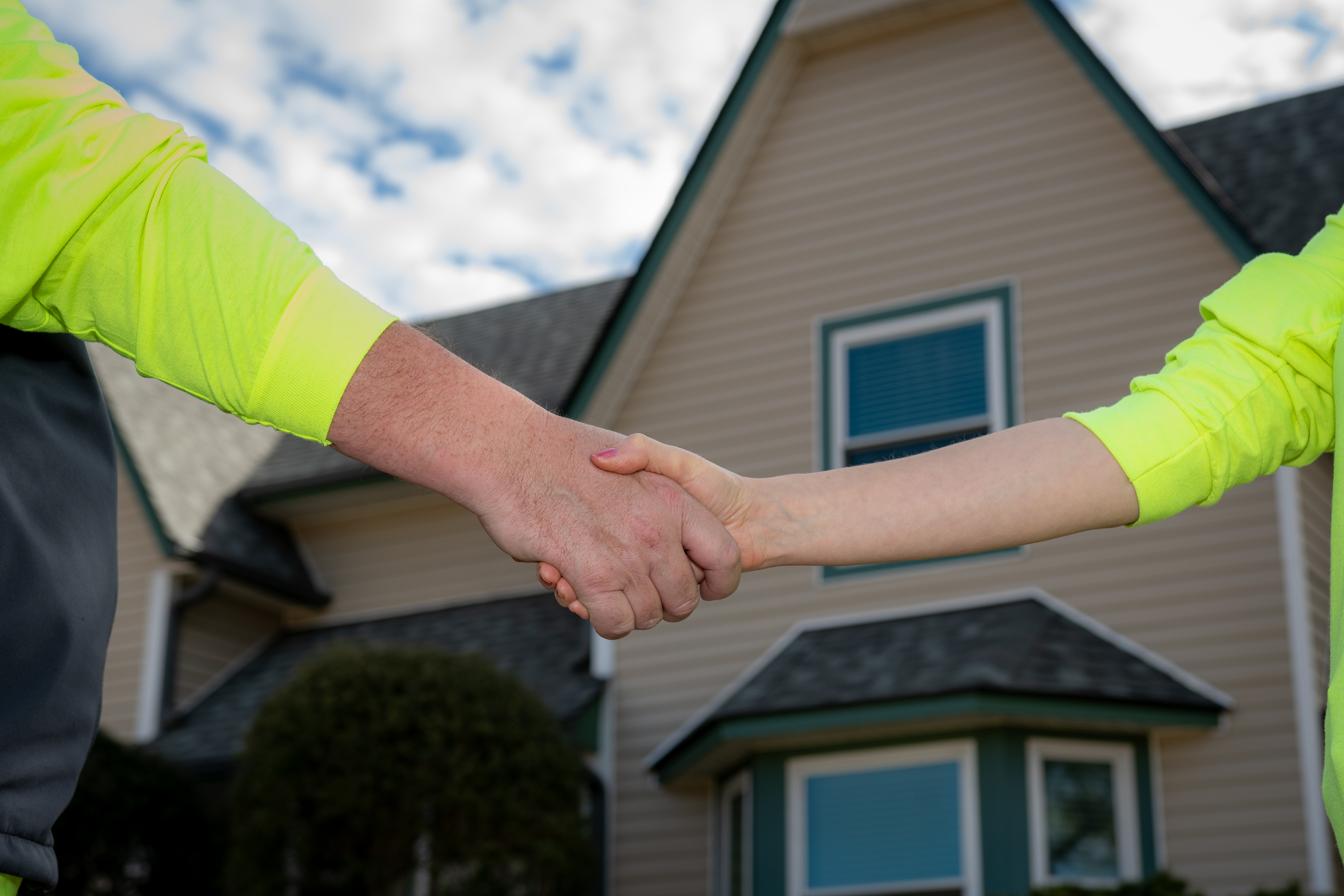 Rob Moore shaking hands with his wife