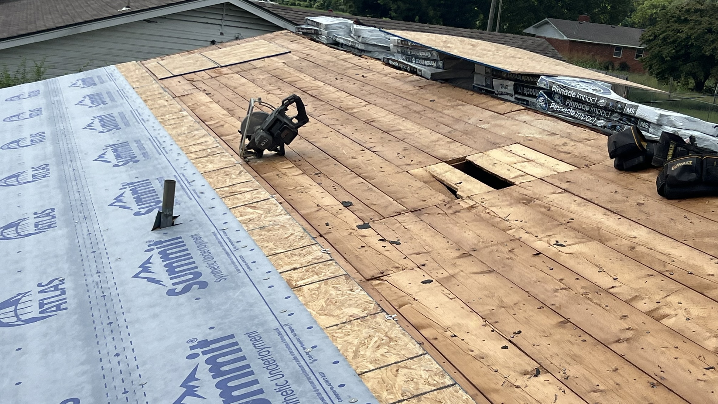 Install in progress — underlayment down, Pinnacle Impact bundles staged on ridge