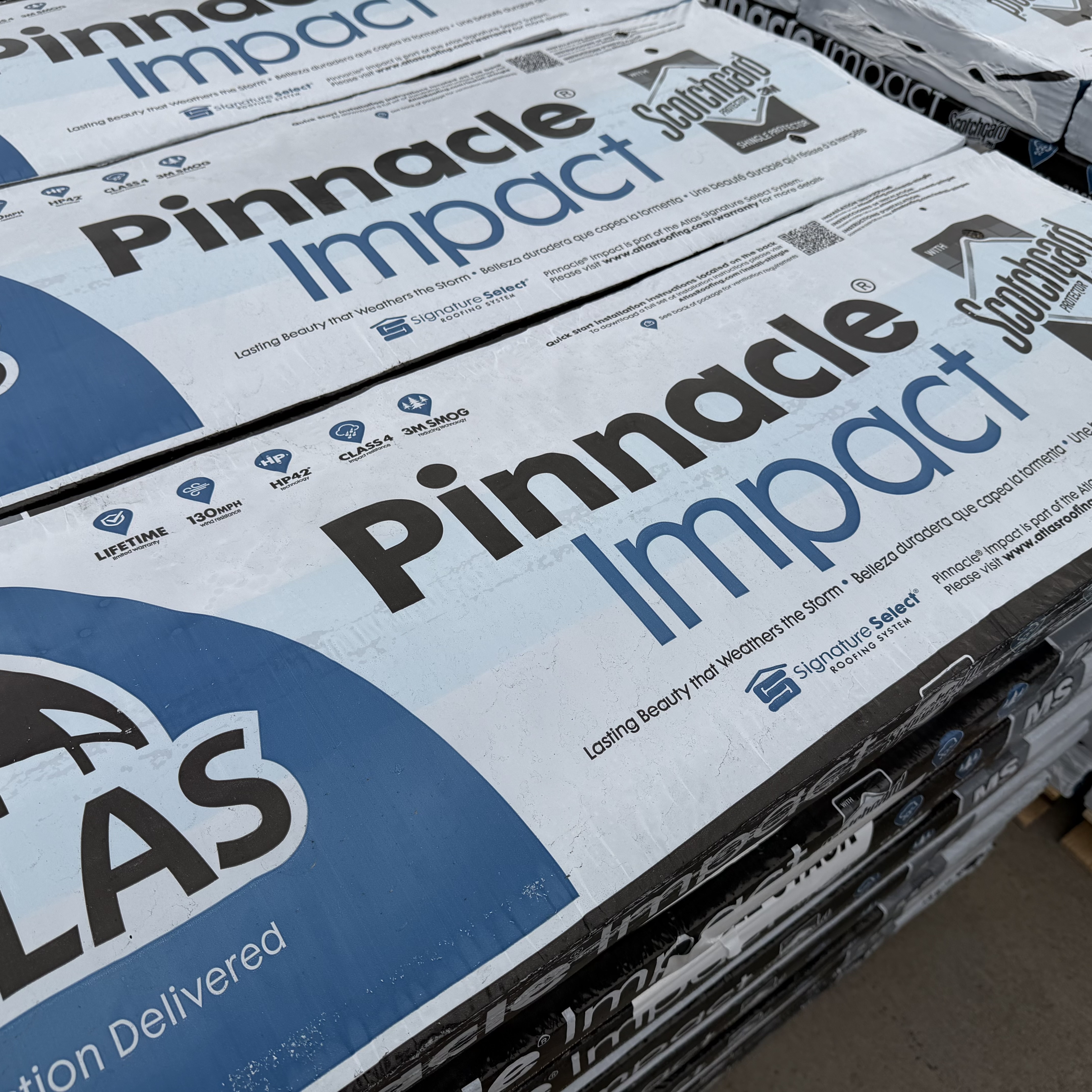 Atlas Pinnacle Impact bundles stacked — Class 4 label visible on packaging