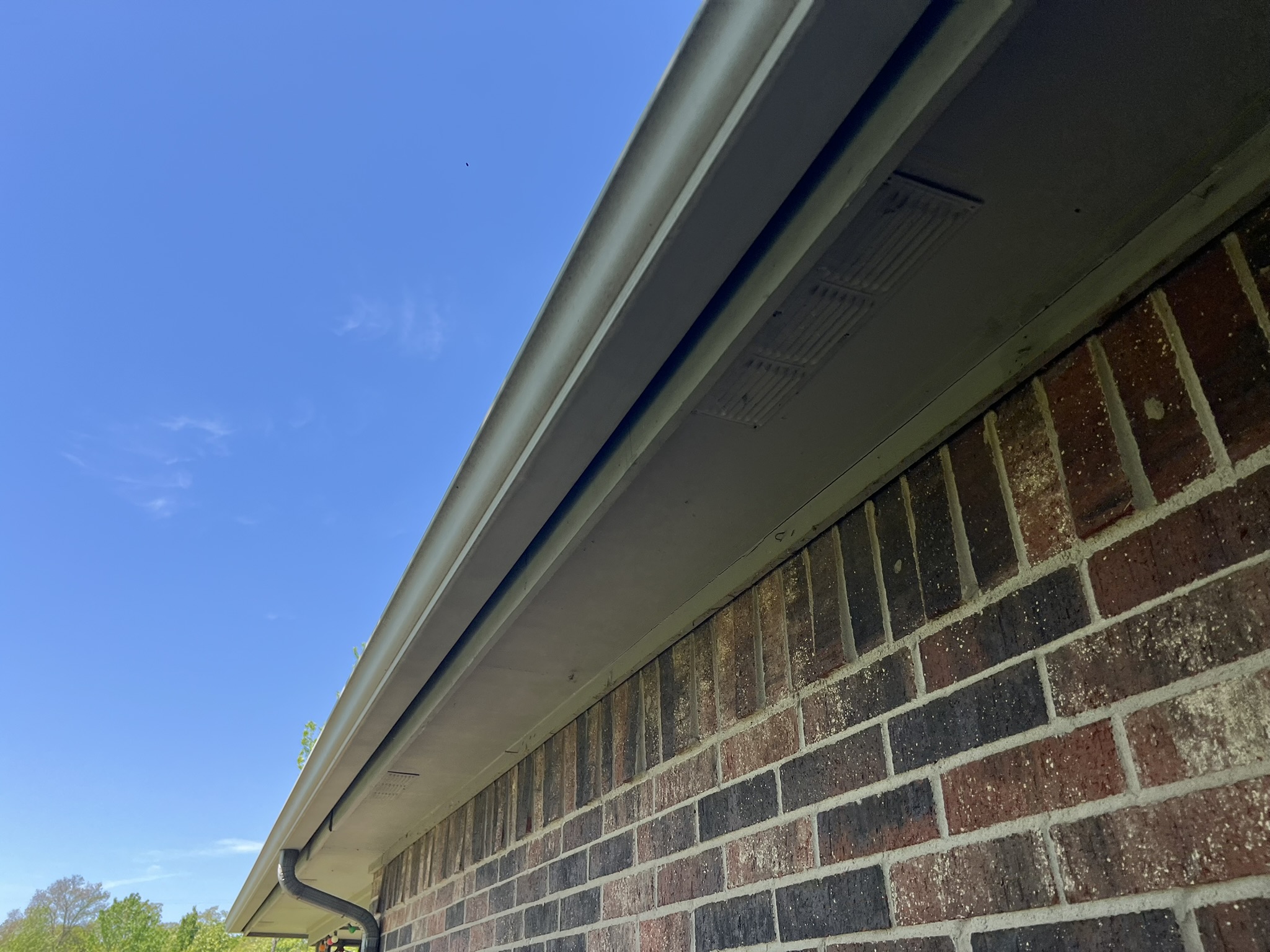 Soffit area with minimal venting showing inadequate intake ventilation