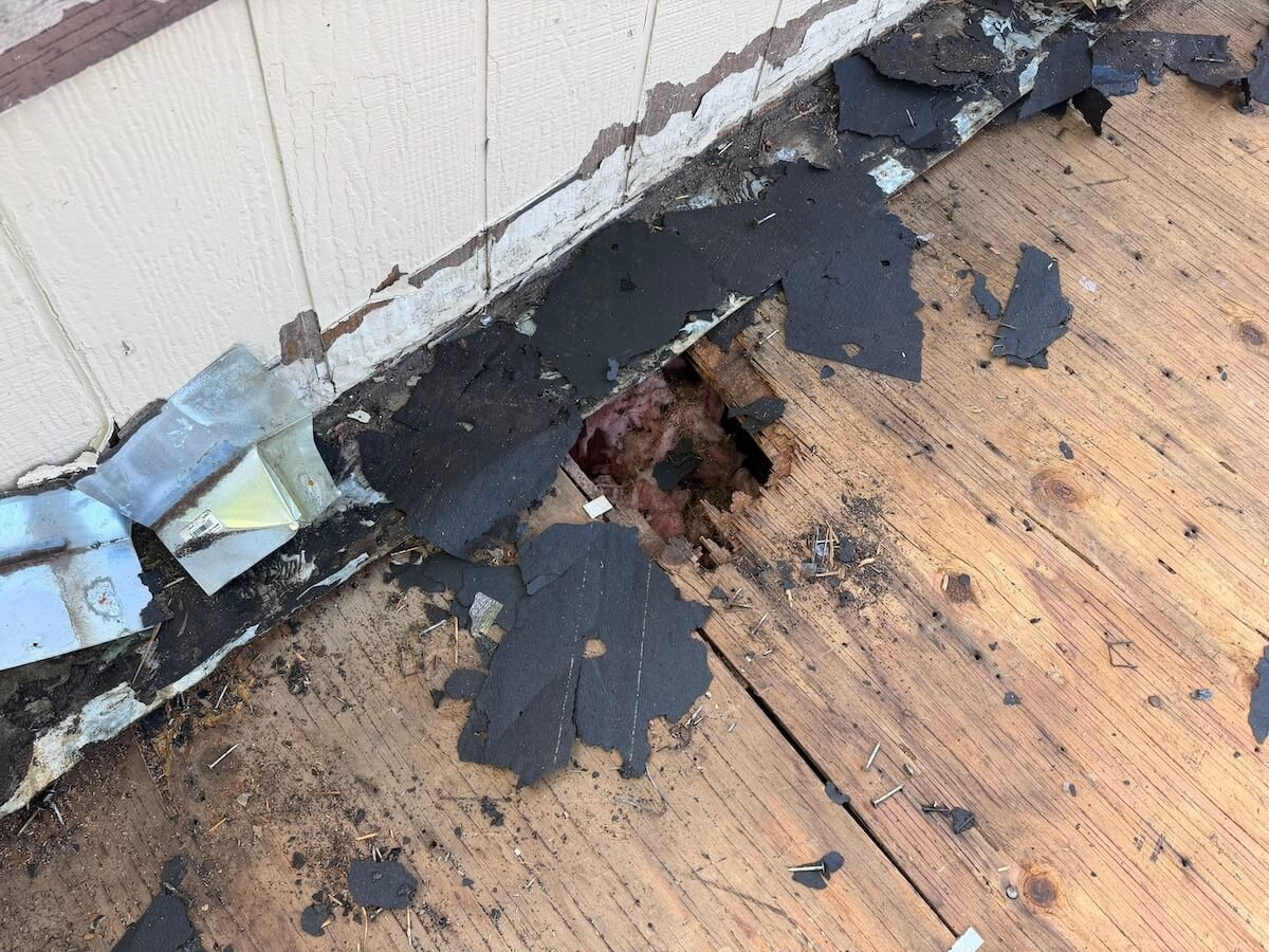 Roof repair and patching work in progress