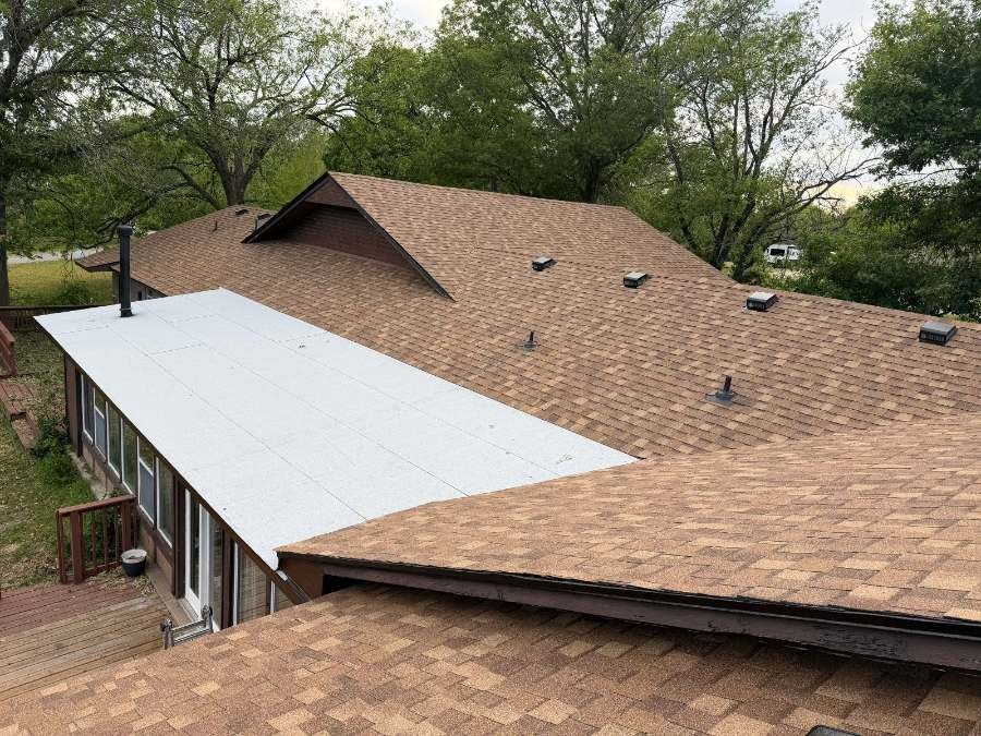 A newly shingled Tulsa roof with new vents and pipe flashings
